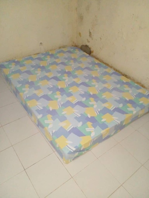 Covered mattress on the floor